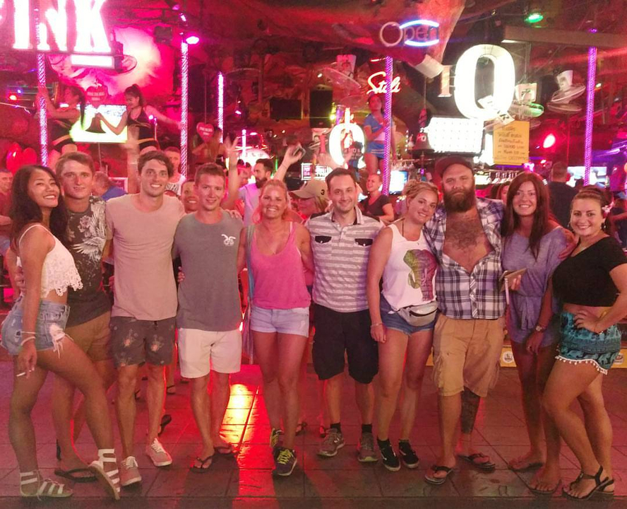Group of people at a lively night venue.