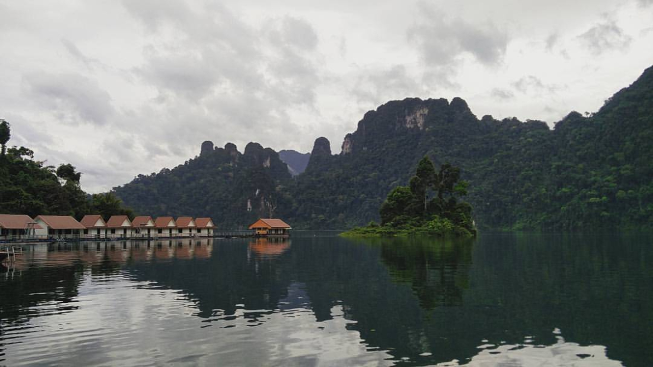 Calm lake with reflection of hills.