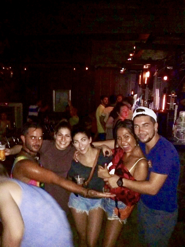 Group of people at a lively indoor event or party.