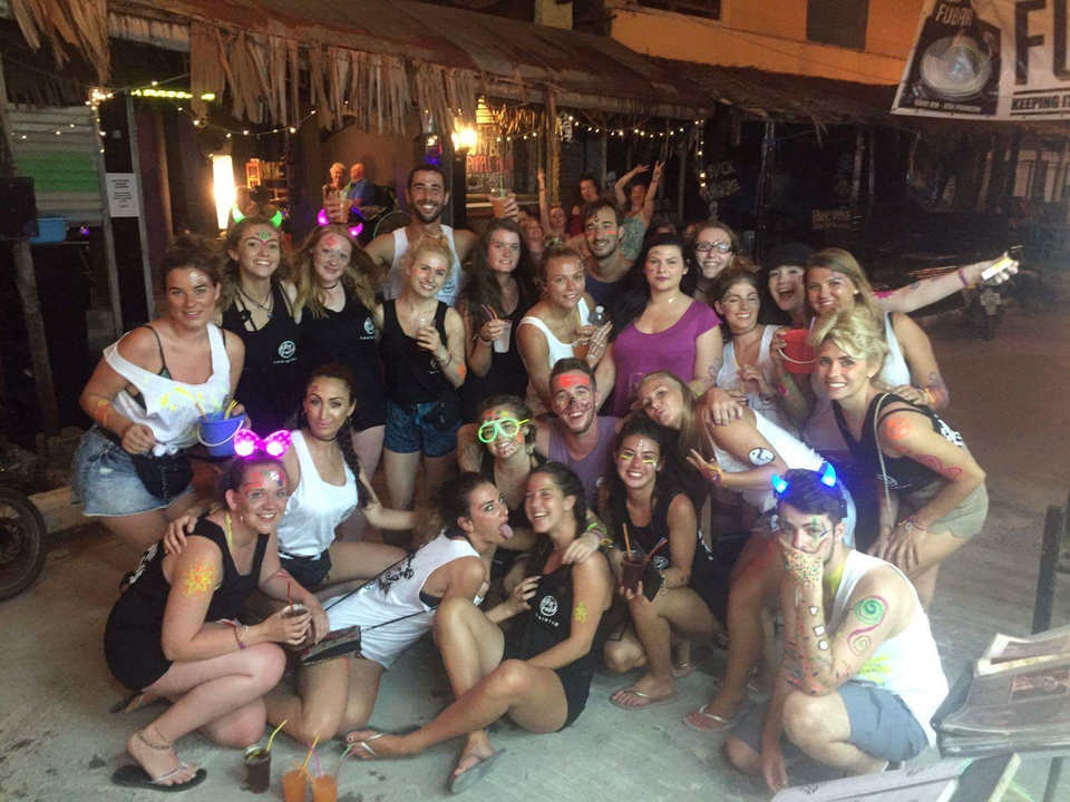 Large group of people with face paint enjoying a night out.