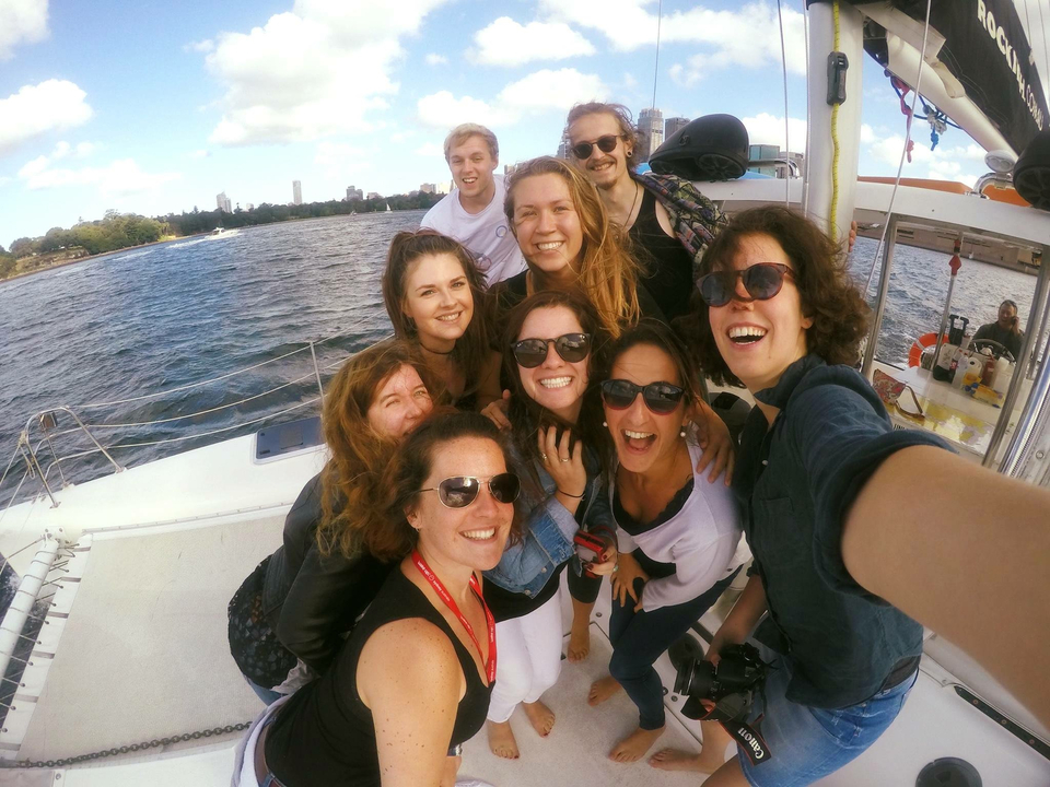Group of people taking a selfie on a boat.