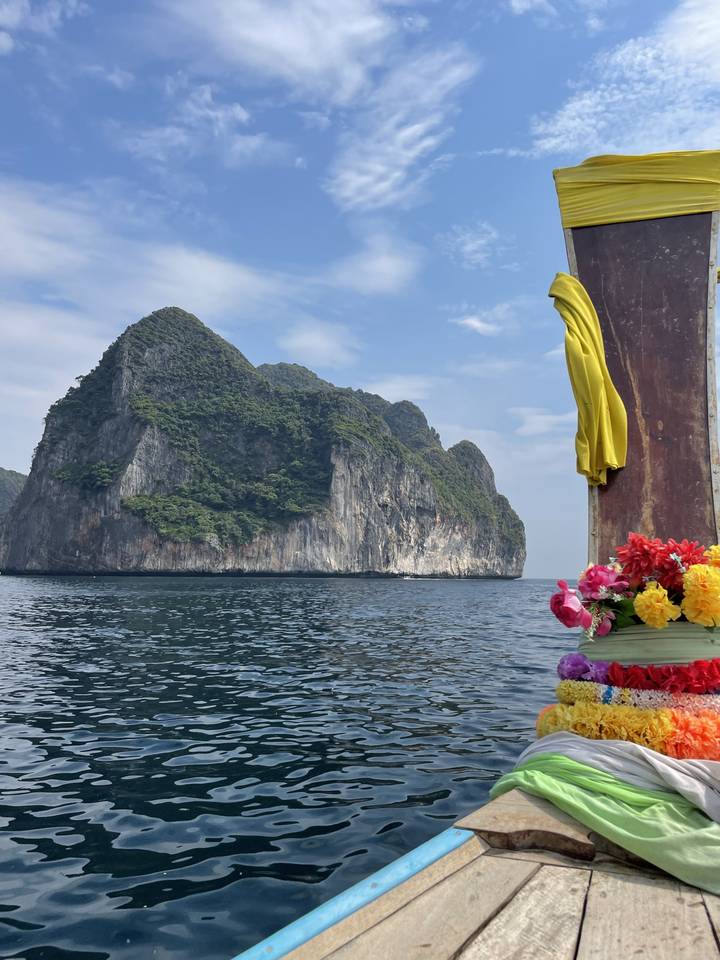 Scenic view of water with distant islands seen from a boat.