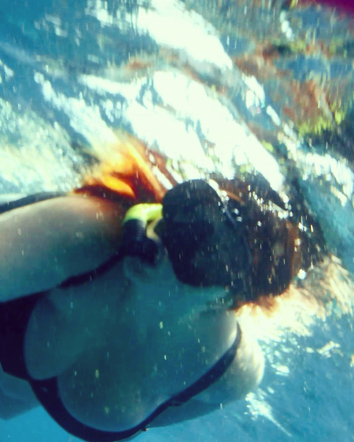 Underwater photo of a person with a snorkel.