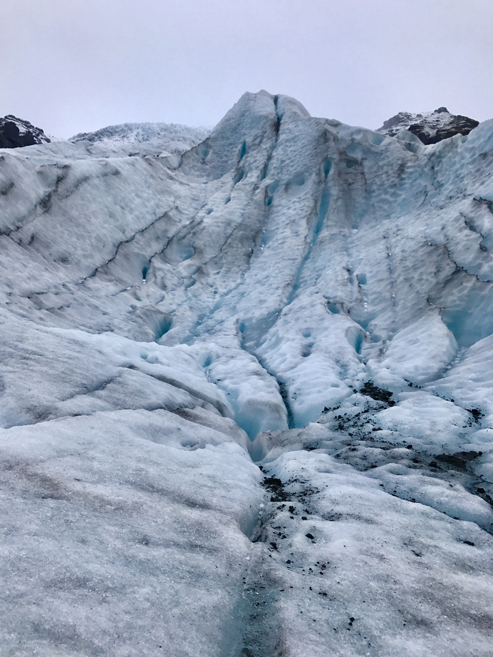 Close-up of blue ice formations on a glacier.