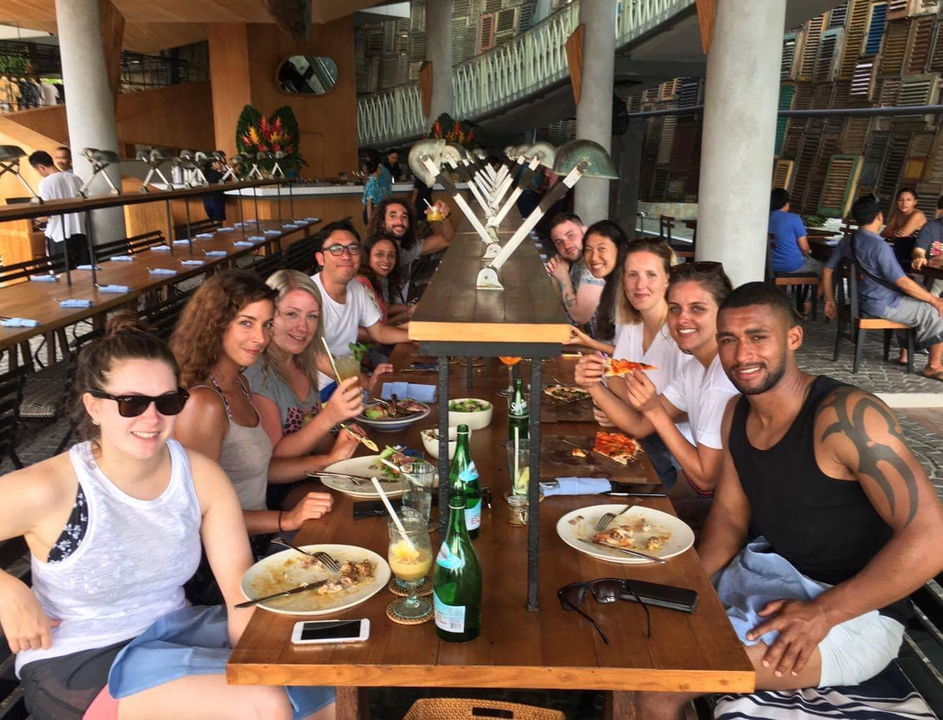 Group of people enjoying a meal at a restaurant.