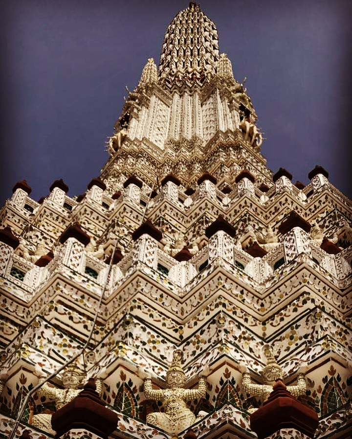 Detailed view of an ornate golden temple exterior.