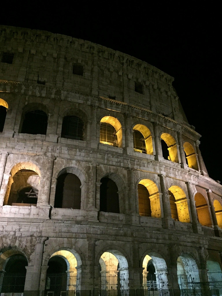 The Colosseum in Rome illuminated at night.