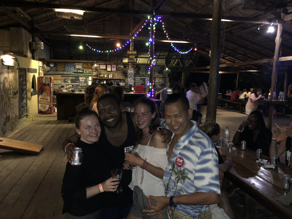 Group of friends enjoying a bar at night.