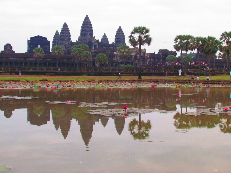Angkor Wat temple reflected in a pond.