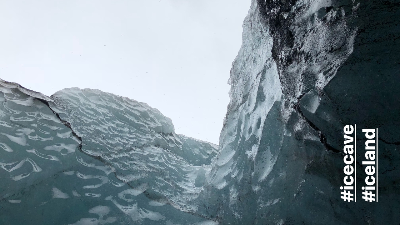 Ice cave with overlay hashtags.