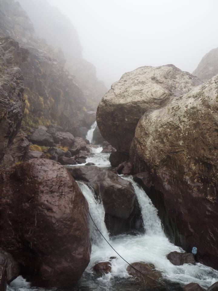 Rocky landscape with a flowing stream.