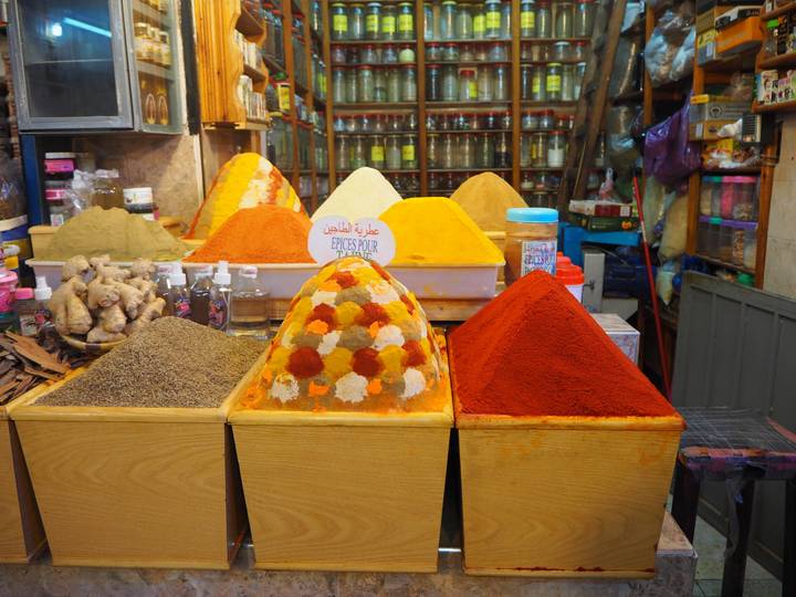 Spices in a market arranged in pyramids.