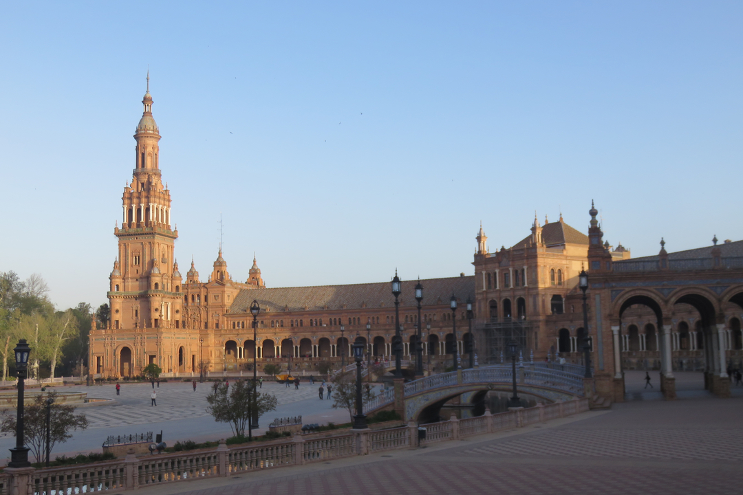 A view of a large plaza with an historic building in an urban setting