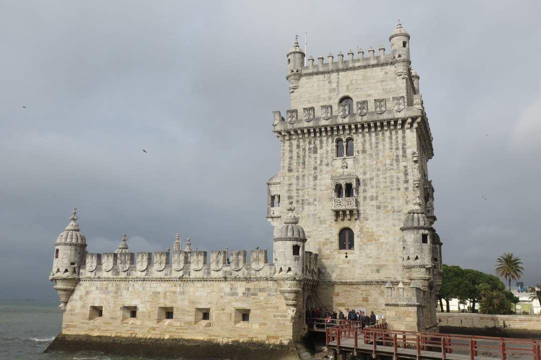 Belém Tower with people gathered at the base
