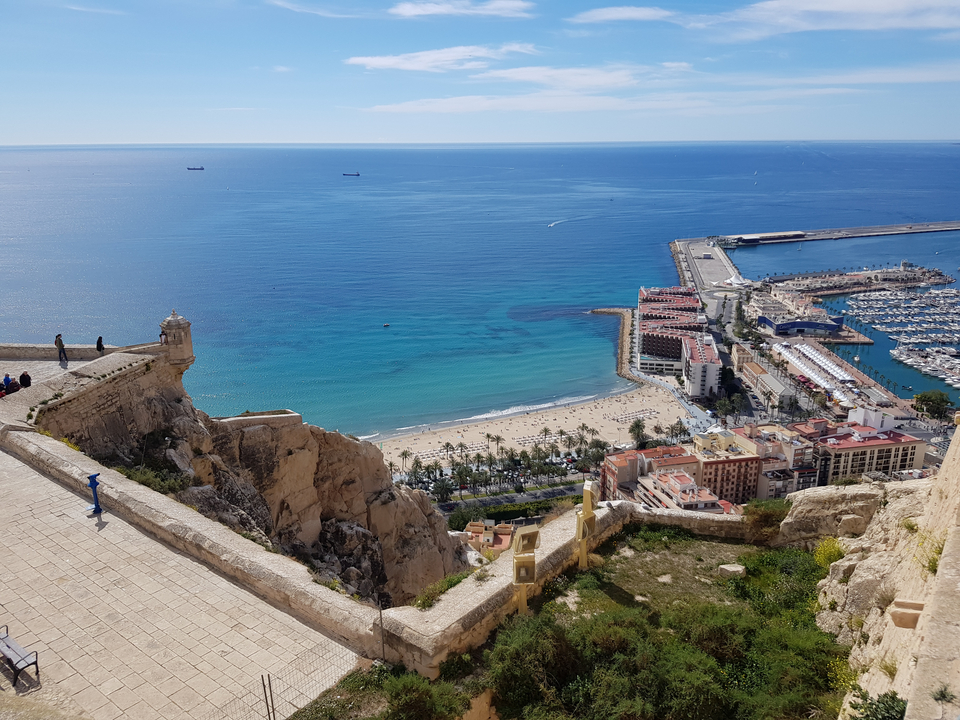 A scenic view of the coastline with the city and harbor
