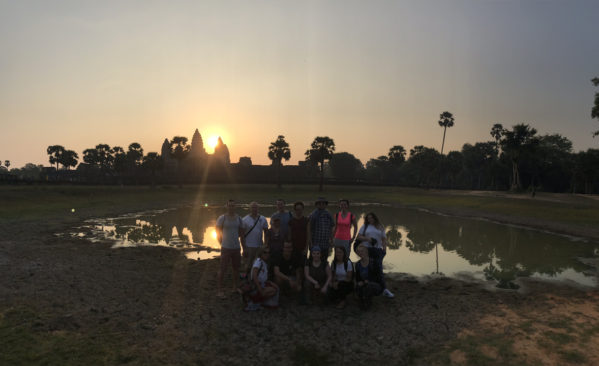 Group photo at sunset near Angkor Wat.