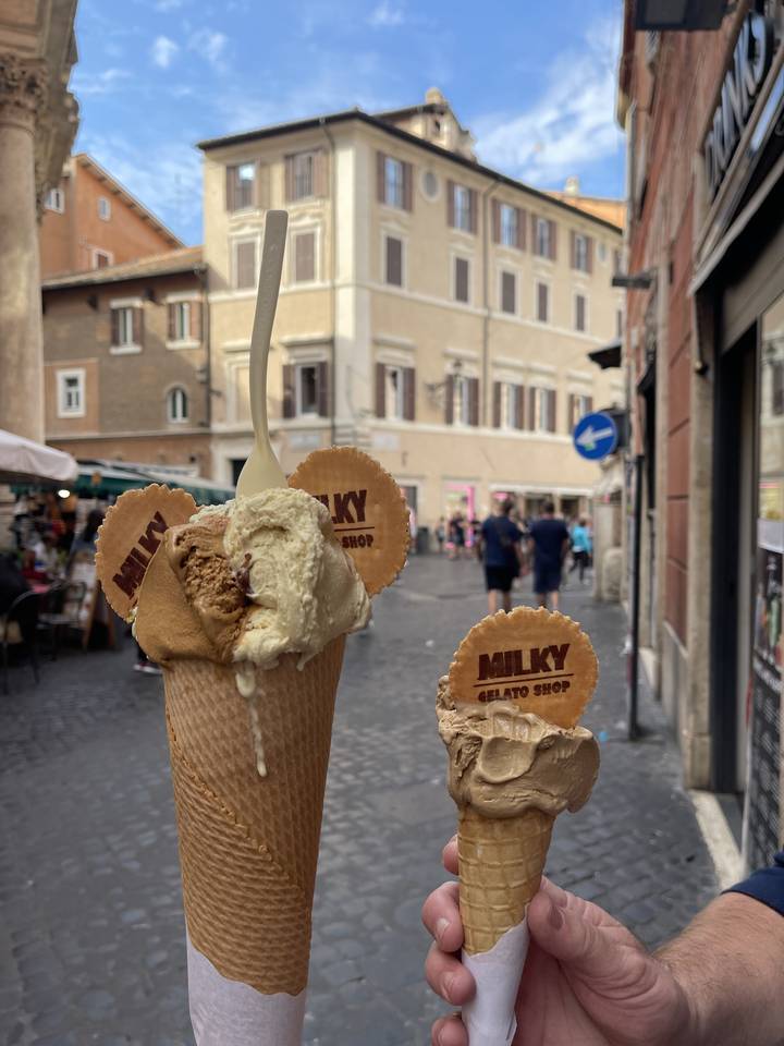People holding ice cream cones.