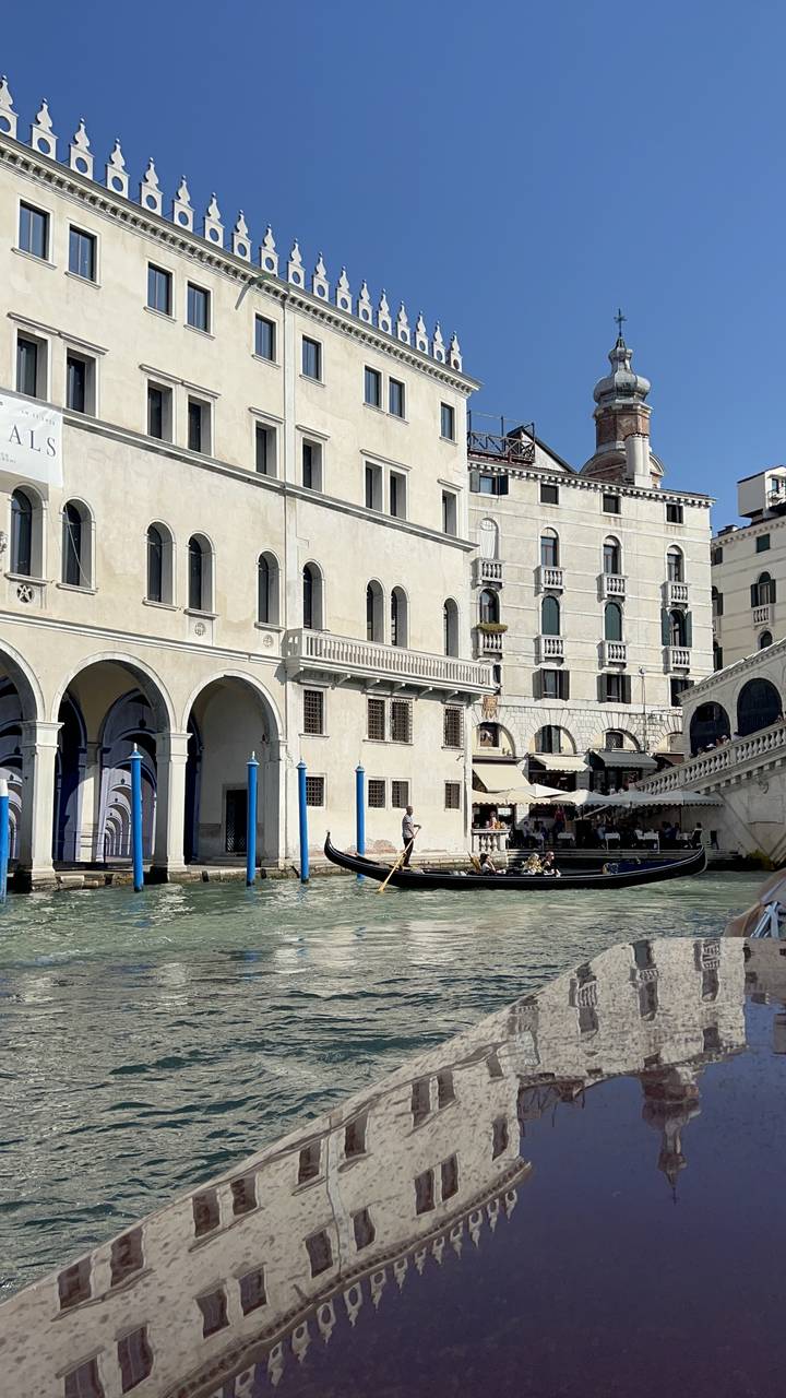 Upside-down view of Venetian buildings from a canal.