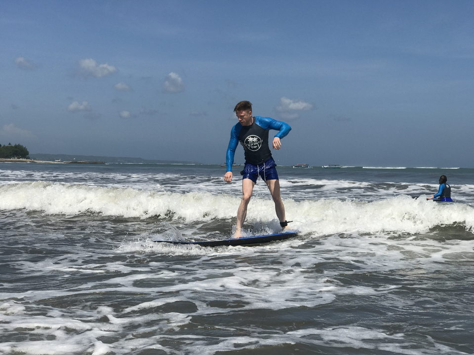 Man surfing on a wave.