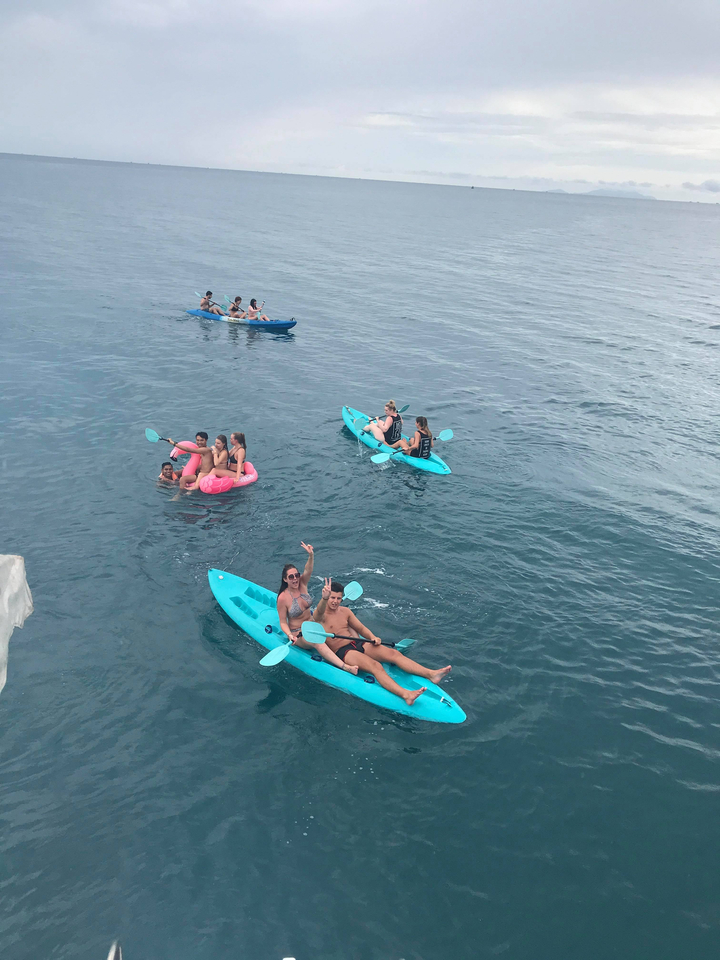 Groups of people kayaking on the sea.