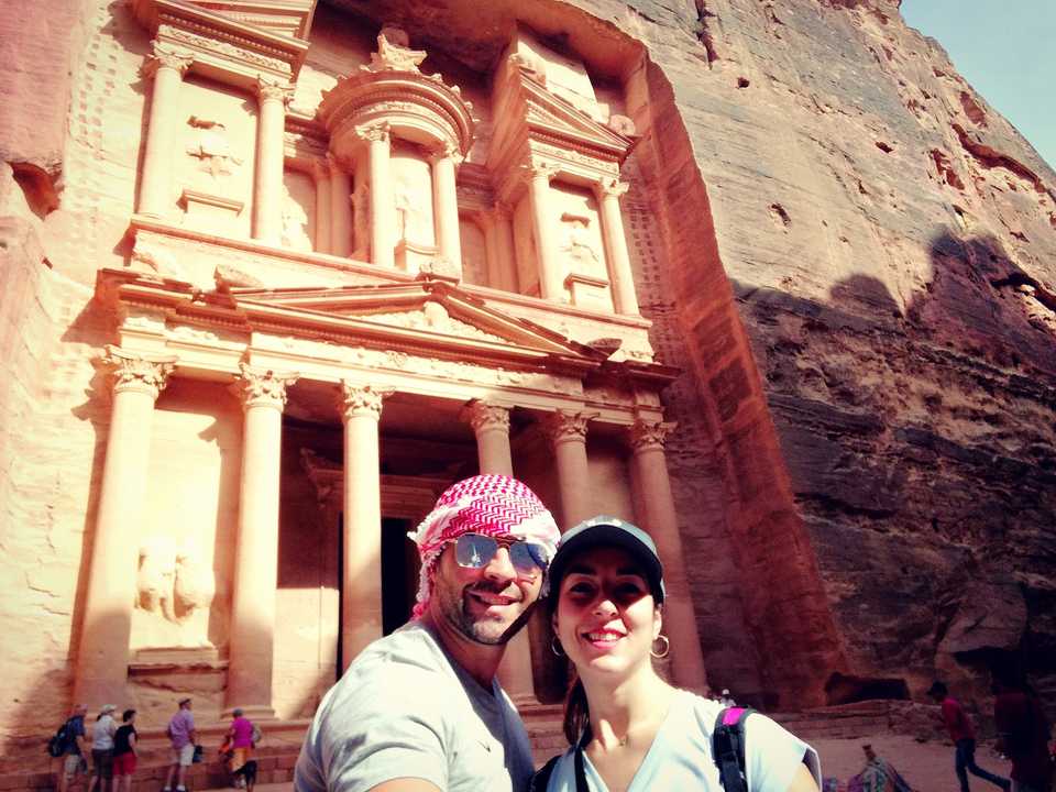 Couple in front of the well-preserved treasury at Petra.