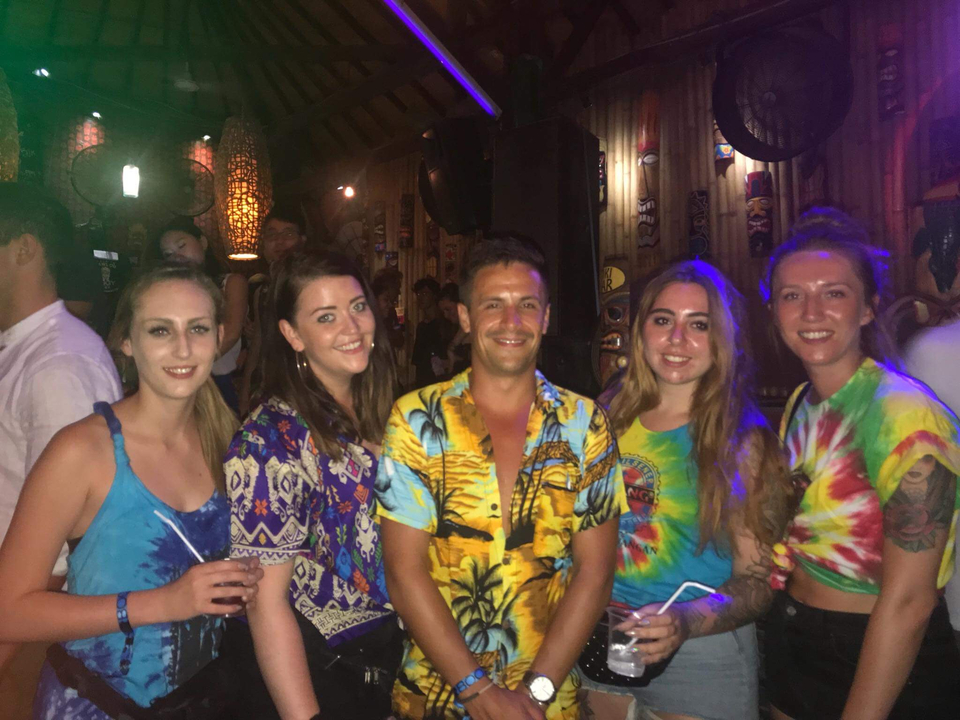 Group of friends at a lively event.