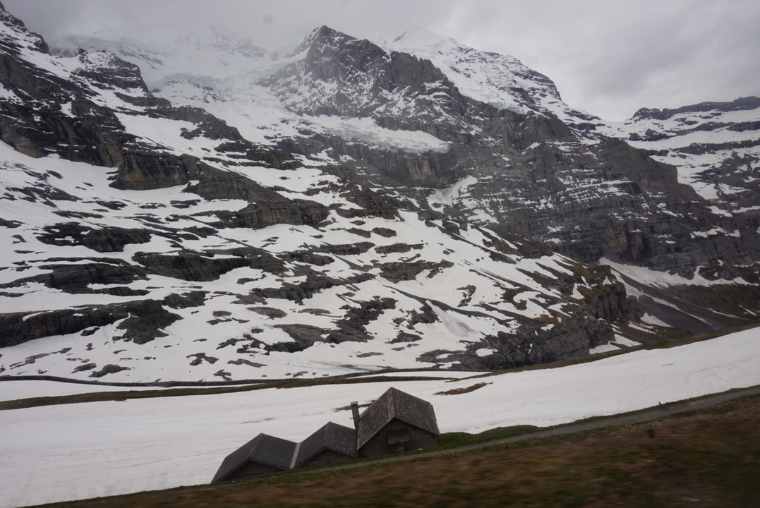 Snow-covered mountain landscape with rugged terrain.