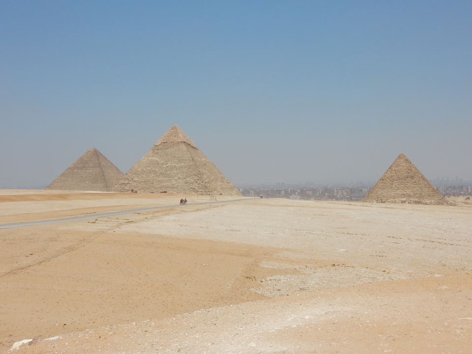 Pyramids of Giza under a clear blue sky.