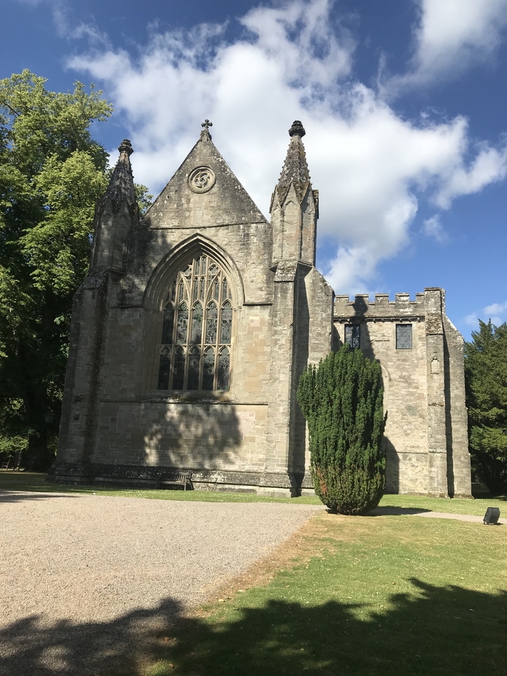 Historic church building with stained glass windows.