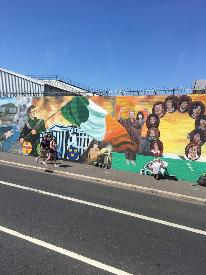 A vibrant mural depicting Irish history and symbols.