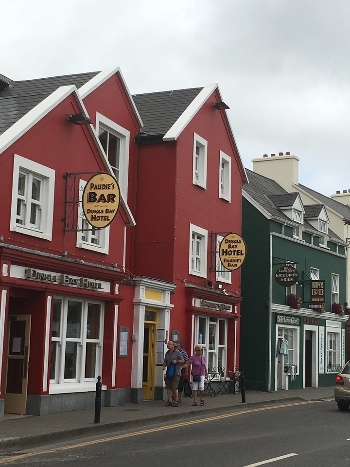 Colorful buildings with visible bar signage on the street.