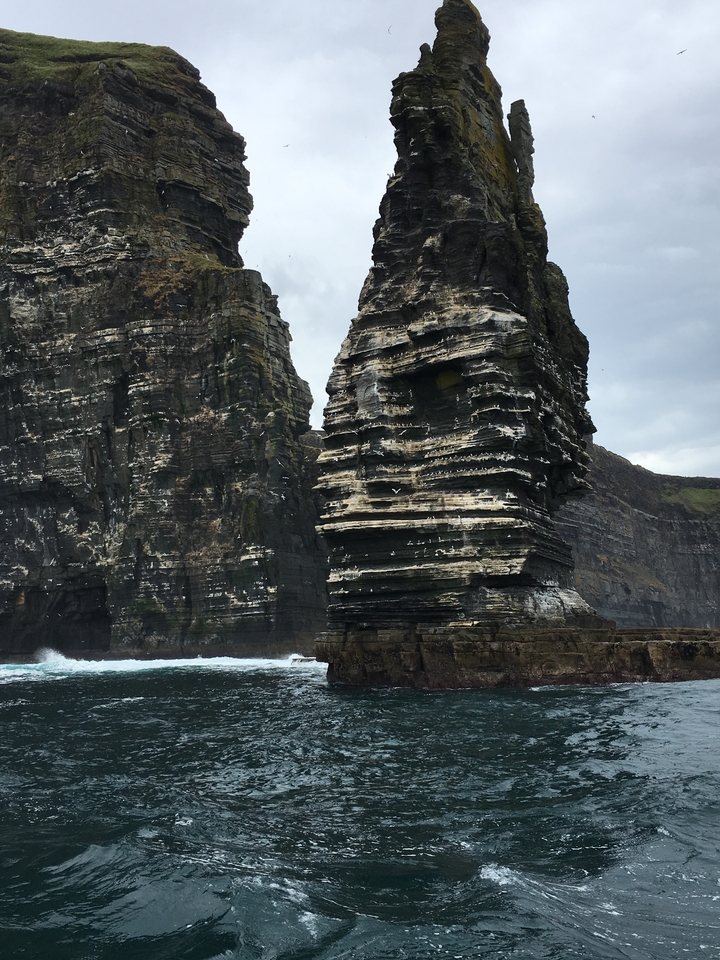 Close-up of rock formations by the sea.