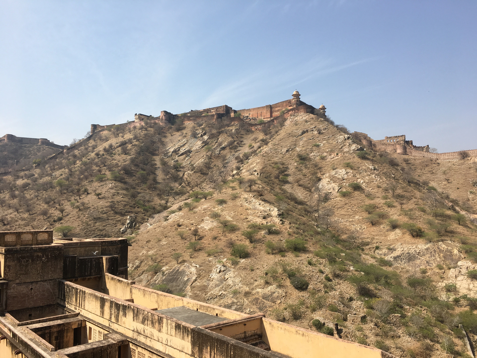 A fort on a hill with a partially visible brick structure.