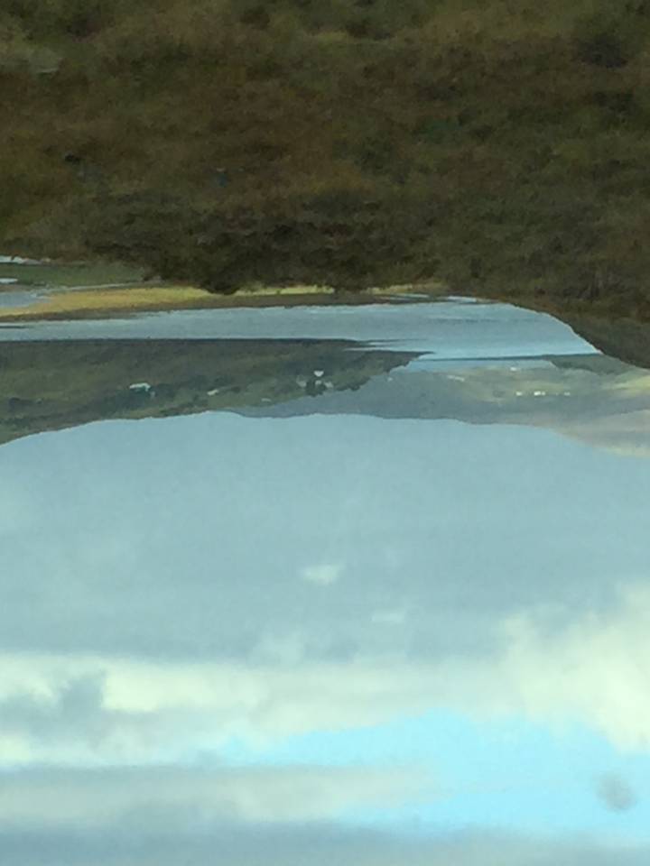 Landscape view with a body of water and hills