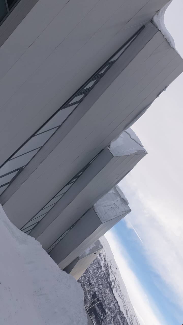 Snow-covered modern architectural structure.