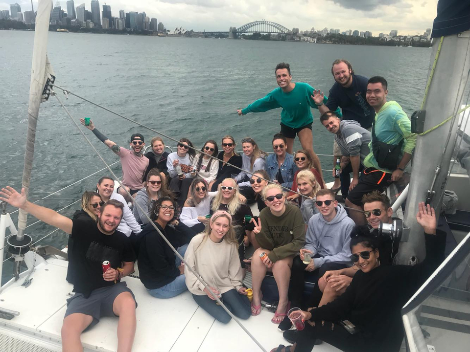 Group of people on a sailboat.