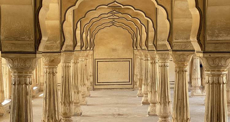 Series of elegant arches and columns in a historic building.