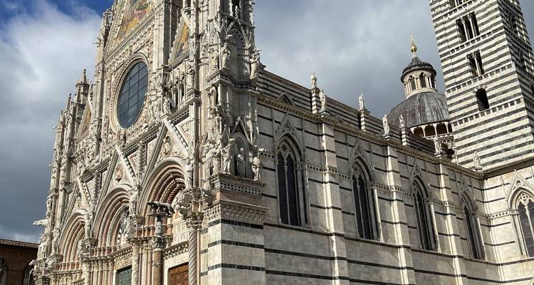 Cathedral facade with people around.