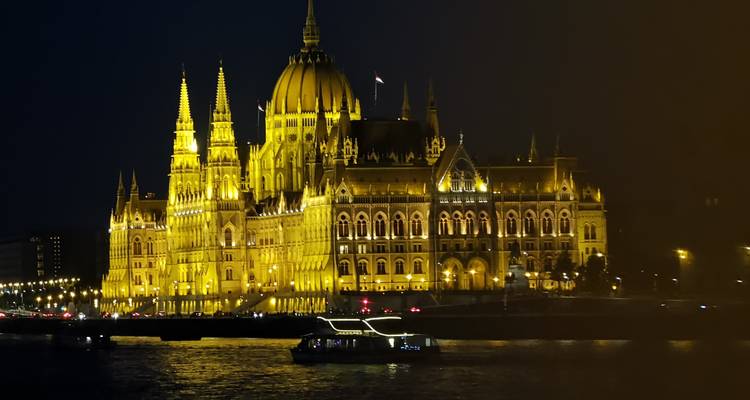The Hungarian Parliament Building illuminated at night.