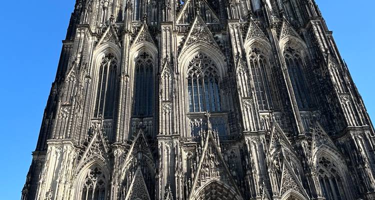 Person with a historic cathedral in the background.