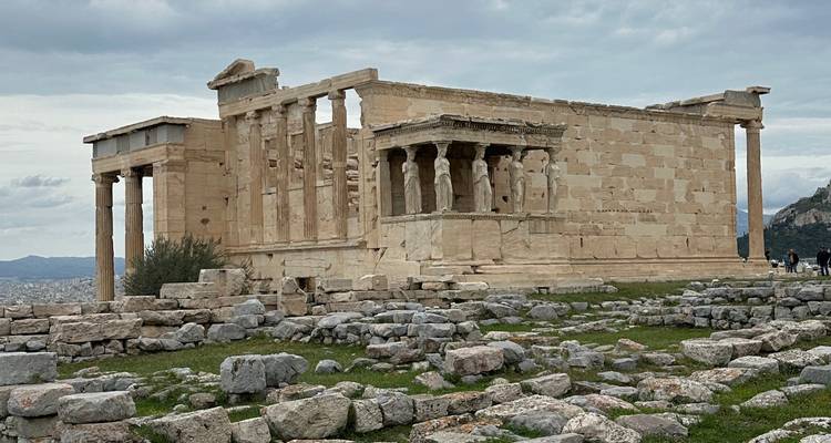 Ancient ruins with a cloudy sky above.