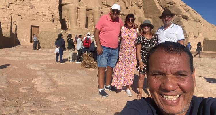 Tourists posing in front of Abu Simbel temple.