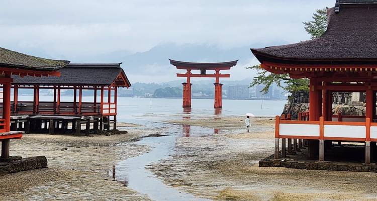 Scenic view of Itsukushima Shrine with iconic torii gate in Hiroshima.