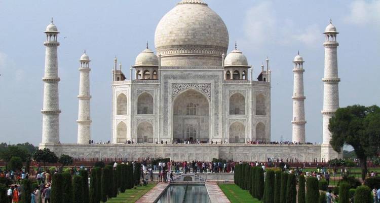 Iconic Taj Mahal with visitors in the foreground.