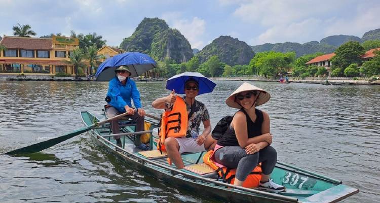 Group enjoying a boat ride in scenic surroundings.