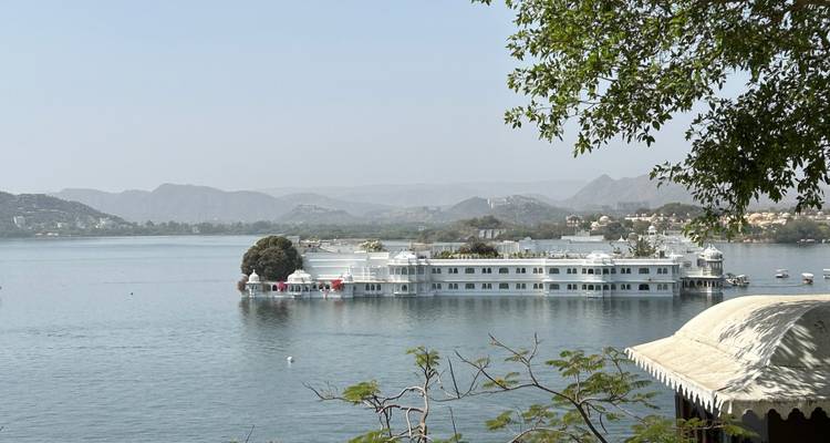 A lakeside view with a palace built on the water.