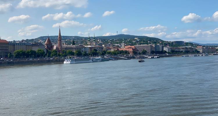 River view with a cityscape and church towers.