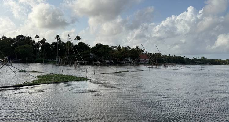 Backwater scene with fishing nets and cloudy sky.
