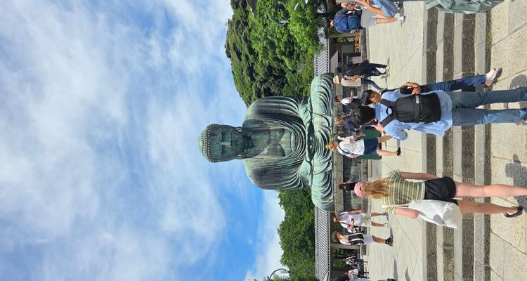 Tourists in front of the Great Buddha statue.