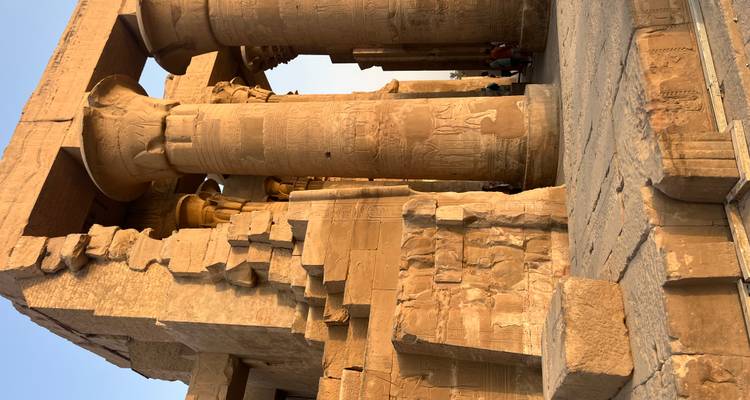 Ancient Egyptian temple with large columns and carvings.